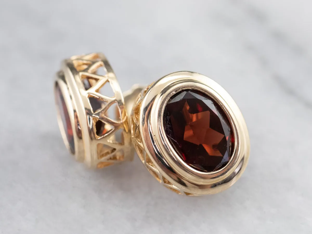 Bezel Set Garnet Stud Earrings in Yellow Gold
