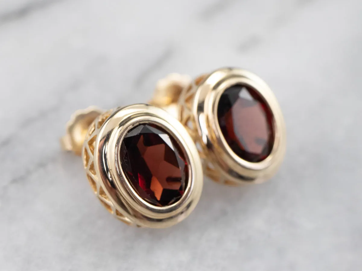 Bezel Set Garnet Stud Earrings in Yellow Gold