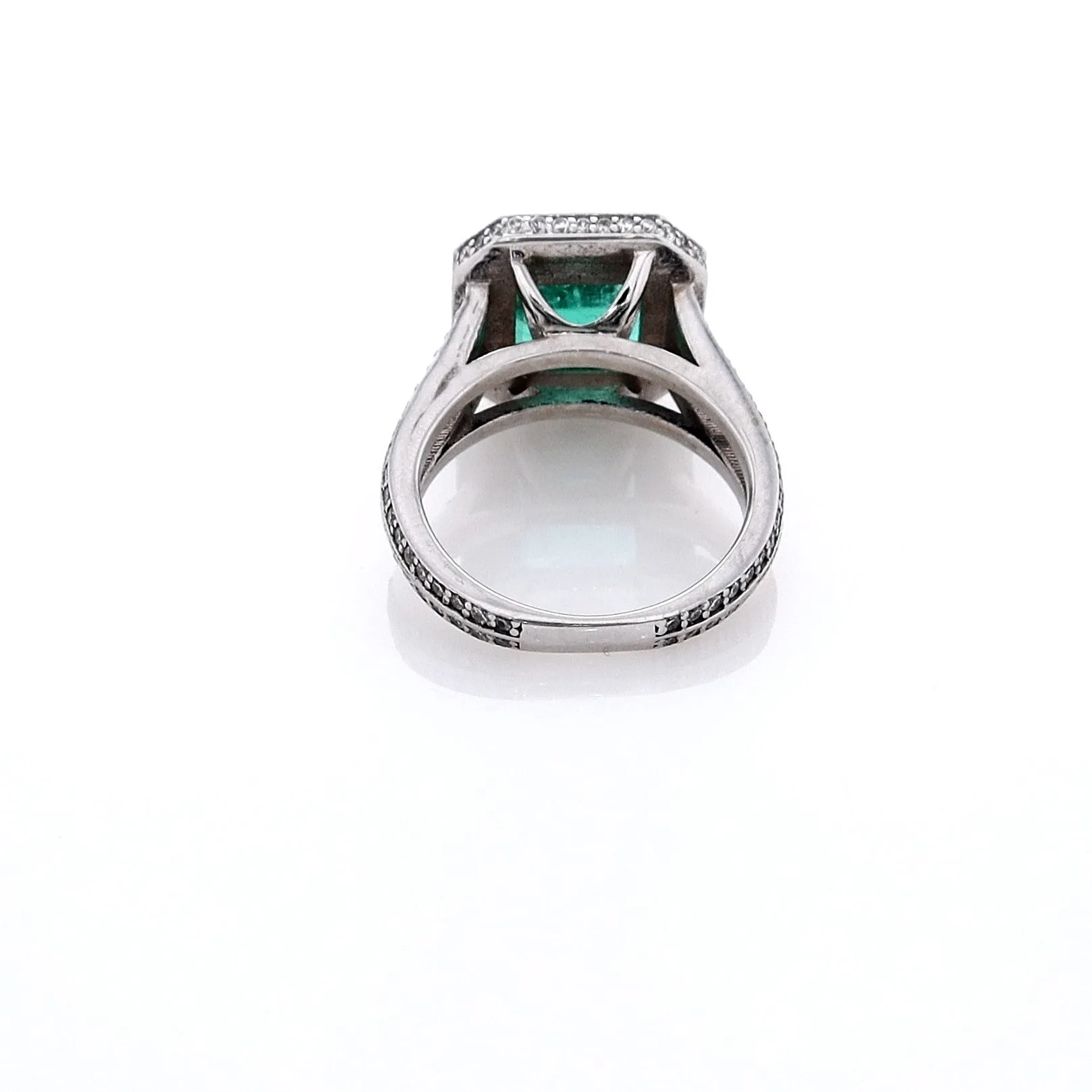 Estate Jewelery 18k White Gold Emerald and Diamond Halo Split Shank Ring