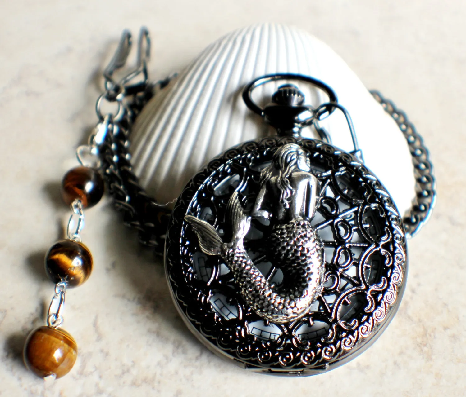 Mermaid battery operated pocket watch.