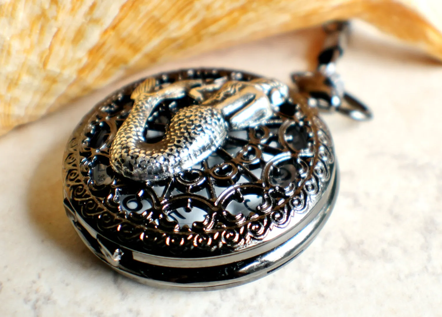 Mermaid battery operated pocket watch.