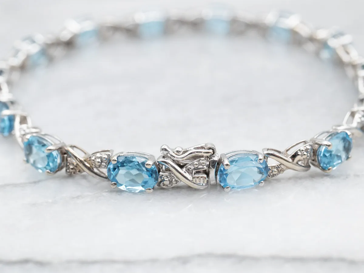 White Gold Blue Topaz X Link Tennis Bracelet with Diamond Accents